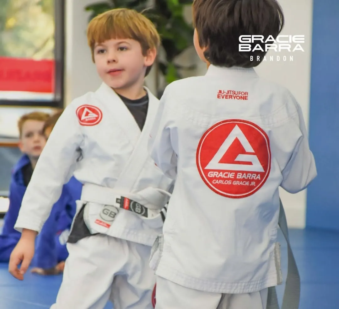 Two Little Champions students facing each other on the mats in a kids Jiu-Jitsu class at Gracie Barra Brandon.